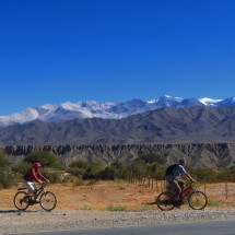 Bicycling down to Cachi with the snowy mountains Nevados de Cachi in the background